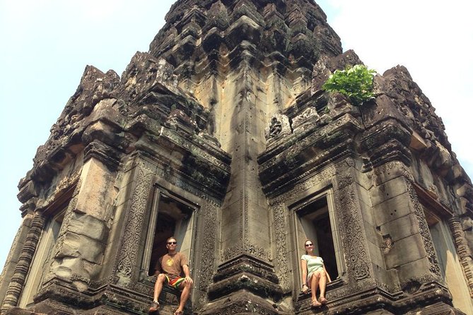 2-D Angkor temple tour with one sunrise in A/C vehicle and guide. - Victory Gate at Angkor Thom: worth slowing down for
