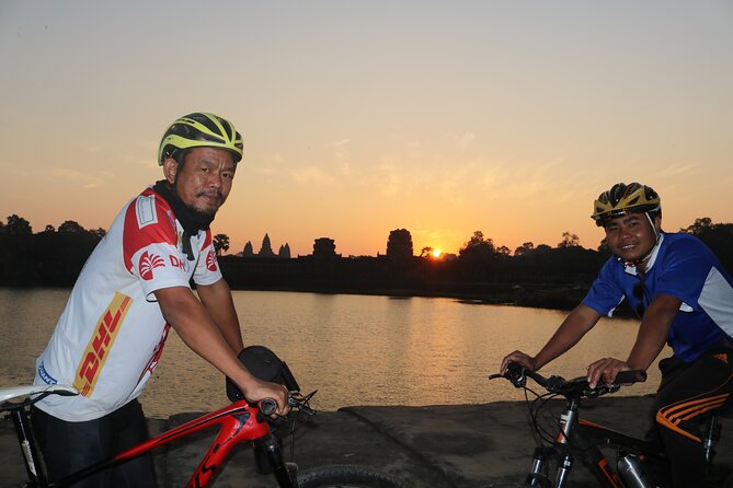 Angkor Sunrise Expedition Cycling Through Serene Backroads - Ta Prohm on a bike: tree roots, village roads, and a calmer feel