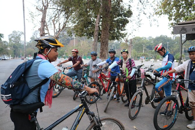 Angkor Sunrise Expedition Cycling Through Serene Backroads - Angkor Thom wall cycling: the moat side, the jungle side, and big stone faces