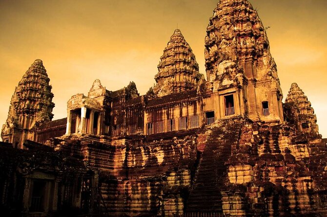 Angkor Thom Ta Prohm and Sunset in Angkor Wat Golden Hour Tour - Ta Prohm: tree roots, Tomb Raider frames, and strange creature carvings