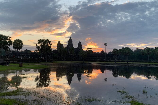 Angkor Wat Sunrise and Angkor Thom Sunset Tour - Entering Angkor Wat at dawn: cooler air, big drama
