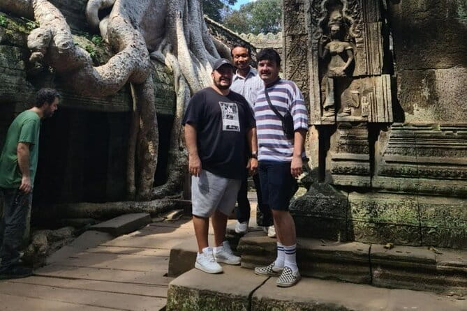 Full Day Angkor Wat Sunrise and Banteay Srei Tour - Exploring the carvings with a guide who adjusts to your group