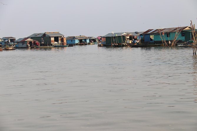 Guided Floating Village Boat Tour in Siem Reap - Long-tail cruising among floating village stilt homes and fish farms