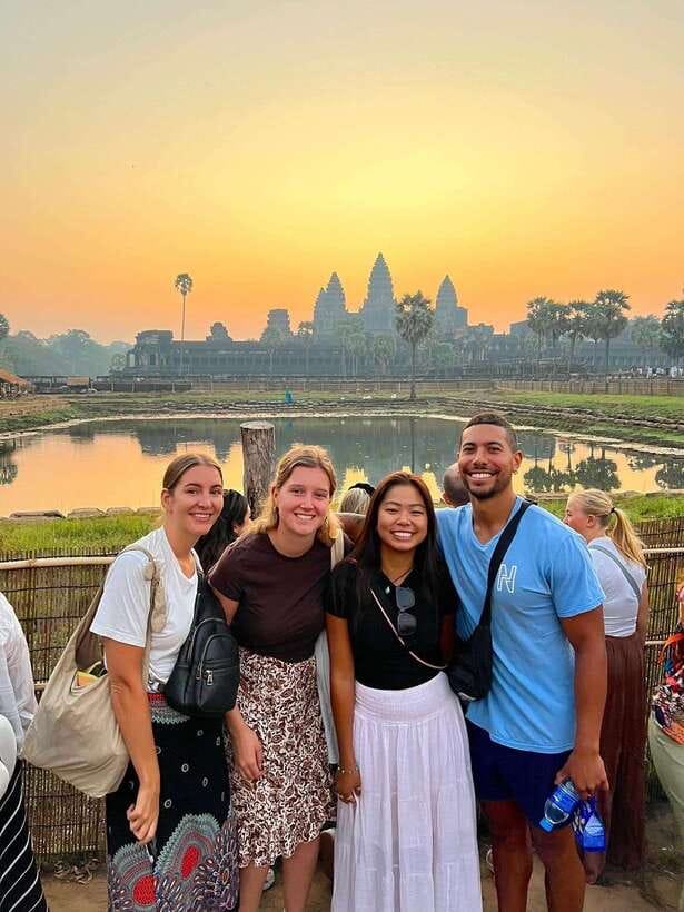 Siem Reap: Angkor Wat Sunrise and Full-Day Sightseeing Tour - Bayon and South Gate City: smiling faces and a stone causeway