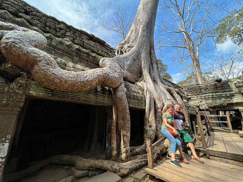 Siem Reap: Angkor Wat Sunrise and Market Tour by Jeep - Bayon Temple stone faces and Victory Gate storytelling