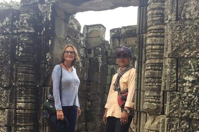 Siem Reap Private Day Tour: Angkor Wat Sunrise, Bayon & Ta Prohm - Ta Prohm: Jungle Overgrowth and the Photo Challenge